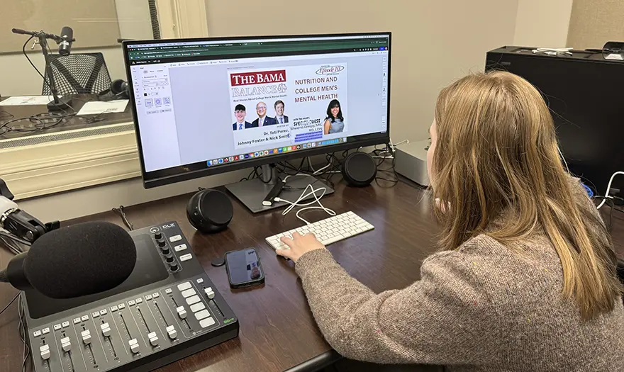 Student editing an ad on a computer